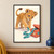 Tawny lion cub reaching toward a turquoise ribbon spilling from a coral toy box on an ivory ground.; frame shown for styling only