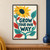 Yellow-orange sunflower and curling turquoise stem frame the words “GROW YOUR OWN WAY” with colorful collage leaves.; frame shown for styling only
