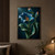 Sculptural blue trumpet flower with curling green leaves and two smaller upright flower forms against a dark teal background.; frame shown for styling only