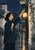 A woman in an indigo jacket raises a glowing paper lantern beside an open doorway in a rainy courtyard.