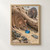 A brown rat and a gray rat inspect a glossy blue pebble on sandy ground beside diagonal driftwood and small coastal stones.; frame shown for styling only