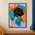 Round black cat sitting in a teal and orange cardboard box, reaching for a dangling strip of packing paper against a pale lilac background.; frame shown for styling only