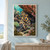 Blue-ringed octopus with curled arms among tide-pool stones and anemones beneath a rust-colored rock ledge.; frame shown for styling only
