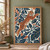 Spotted, tuft-eared lynx leaping diagonally through angular foliage in terracotta, dark blue, cream, and gold.; frame shown for styling only