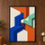Interlocking blue, orange, mint and ivory stair-step bands converge around a small open center in a textured geometric collage.; frame shown for styling only