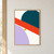 A large cropped deep-teal circle crossed by a diagonal vermilion band, with a pale-lilac curve and saffron square on warm white.; frame shown for styling only