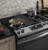 JGSS66SELSS GE 30" Slide-In Front Control Gas Range with Steam Clean and In-Oven Broil - Stainless Steel