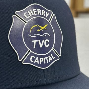 navy hat with uv printed firefighter maltese cross on the front
