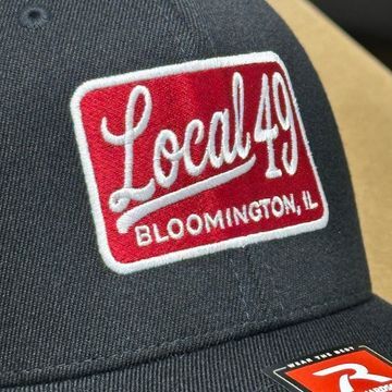 black hat front with red and white fire department patch that says local 49 bloomington, il on the front