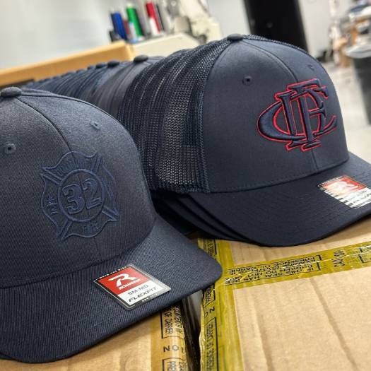 Custom-embroidered firefighter hats with "32 FIRE" and "CFD" insignias