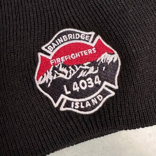 Embroidered firefighter logo on a knit cap, "Bainbridge Island L4034"