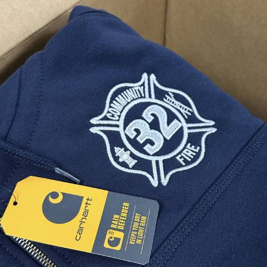 Navy Carhartt hoodie featuring a fire department-themed custom embroidery