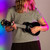 Lifestyle image of the Mad About Black Left-Handed soprano ukulele being played. Lightweight beginner ukulele with carbon strings, geared tuning pegs and a compact 21-inch design, ideal for left-handed children, students and first-time players learning chords, strumming and basic techniques.