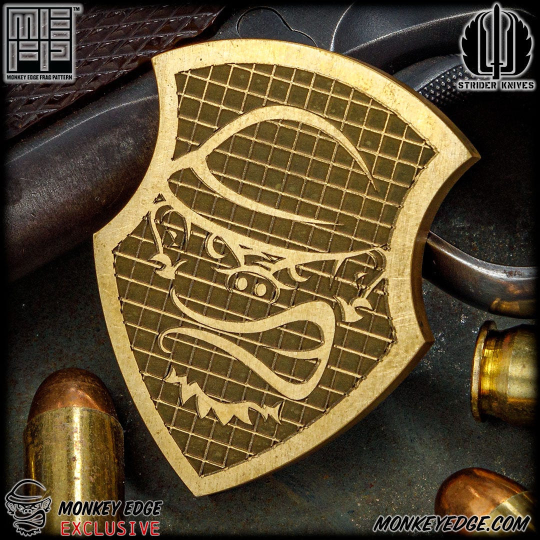 Monkey Edge - Strider Knives Shield Medallion - Brass Monkey Edge