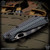 Strider Knives Folder: SnG Dagger Grind - Striped/Gray and Black G10
