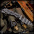 Strider Knives Folder: SnG Dagger Grind - Striped/Gray and Black G10