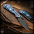 Strider Knives Folder: SnG Bowie Grind - Black/Flamed Monkey Edge FRAG Pattern