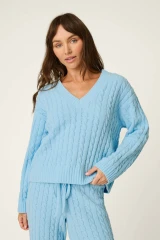 It doesn’t get any softer than this. Crafted from snuggly cable-knit chenille, this pale blue sweater will be your go-to for cozy days and nights. The ultra-plush feel makes it perfect for breakfast in bed, TV marathons, or just curling up with a good book.

Pale blue long-sleeve sweater in a plush cable-knit chenille fabric.
V-neck and drop shoulder.
Fit: True to size.
Models are wearing a size S.