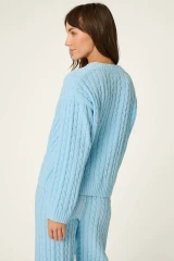 It doesn’t get any softer than this. Crafted from snuggly cable-knit chenille, this pale blue sweater will be your go-to for cozy days and nights. The ultra-plush feel makes it perfect for breakfast in bed, TV marathons, or just curling up with a good book.

Pale blue long-sleeve sweater in a plush cable-knit chenille fabric.
V-neck and drop shoulder.
Fit: True to size.
Models are wearing a size S.