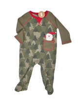 Mud Pie baby Christmas footed romper with green camouflage evergreen tree print, olive long sleeves, red trim, and Santa Claus appliqué peeking from front pocket.