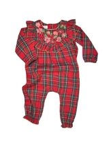 Mud Pie girls Christmas romper in red, green, and navy tartan plaid with embroidered floral neckline, shoulder ruffles, long sleeves, and gathered ankle cuffs.