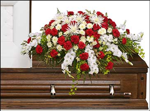 casket saddle with wet floral foam
foliage: teepee, ivy, leather leaf
10 stems white gladiolus
40 red carnations
5 white Fuji mums
5 stems white cushion poms
5 stems white waxflowers