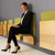 Woman Sitting on Murphy Chair in Professional Environment