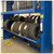 Lifestyle image of Vertical Tire Carousel - 28 inch Max Tire Diameter - Approximately 288 Tire Capacity shown in a real-world storage setting