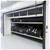 Lifestyle image of Vertical Tire Carousel - 28 inch Max Tire Diameter - Approximately 314 Tire Capacity being used by a worker in a facility setting