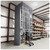 Lifestyle image of Vertical Wire Spool Carousel - 24 inch Max Spool Diameter - 15 Carriers for storage shown in a real-world storage setting