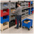 Lifestyle image of Mobile Giant Stack Container - Red for small parts storage being used by a worker in a facility setting