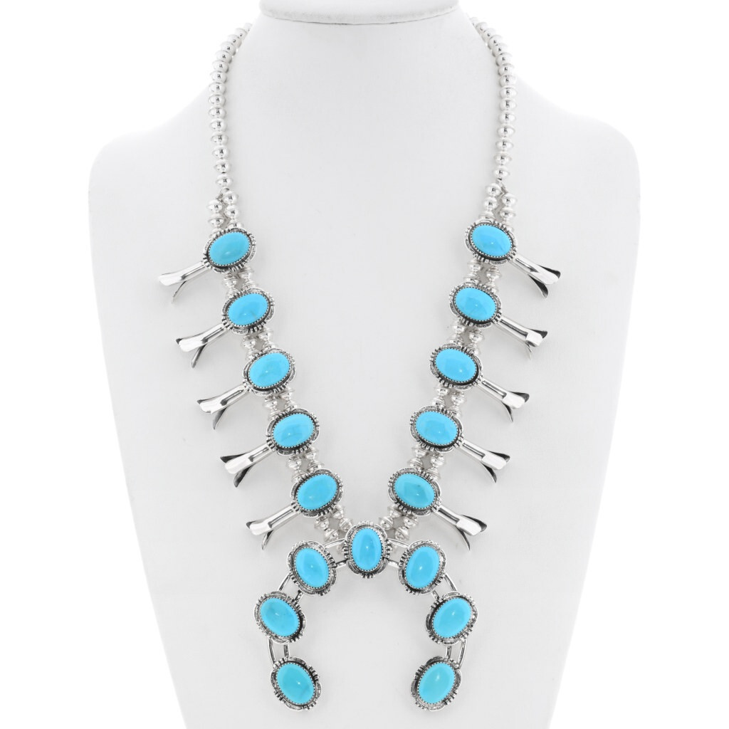 Squash blossom necklaces and naja pendants