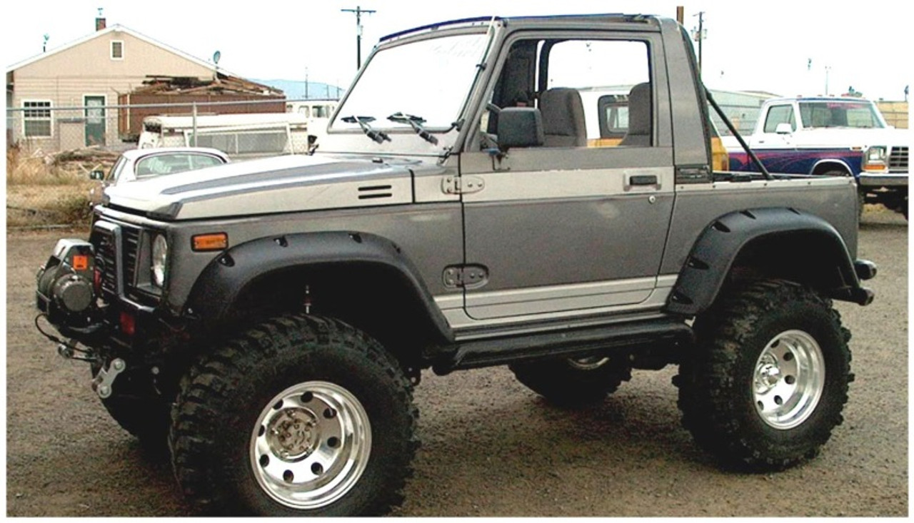 orange suzuki samurai lifted