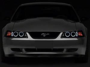 Raxiom 99-04 Ford Mustang Dual LED Halo Projector Headlights- Black Housing (Smoked Lens)