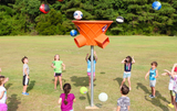 Triple Shoot play equipment shown with children playing,  orange color option.