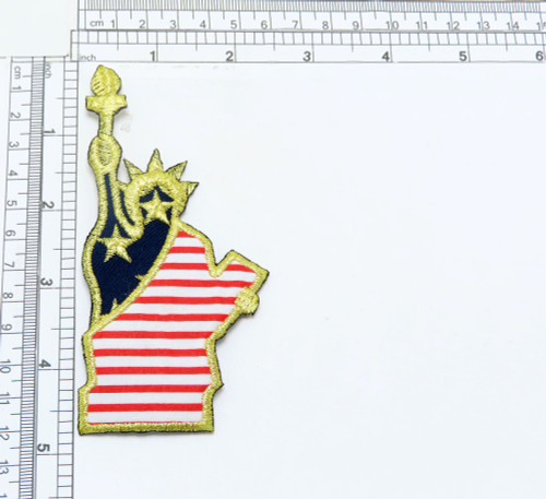 Iron On Patch Applique -Patriotic Statue of  Liberty
Embroidered with Metallic Gold Thread on Stars & Stripes Backing Fabrics
Measures 4 3/4" high x 2 1/4 " wide