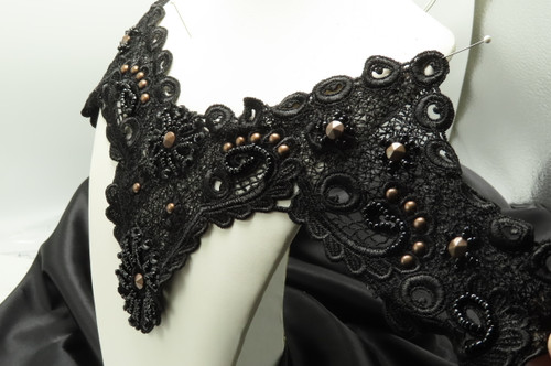 Venice Lace Yoke Panel - Black Beaded Large
Lovely Weight - With Jet Back Bead Detailing and some sequins - Also a Dark bronze Studding throughout the design
Overall Measurement is 17" across (10" across the top peaks)  and 7 3/4" deep