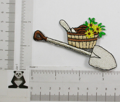 Shovel and Basket with Flowers.