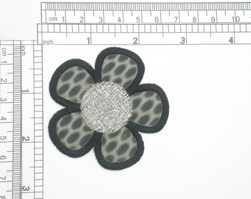 Holographic Daisy Blue Embroidered Iron On Patch Applique 

Embroidered on Holographic Backing with Rayon and Metallic Threads

Measures 2 1/2" high x 2 1/2" wide approximately