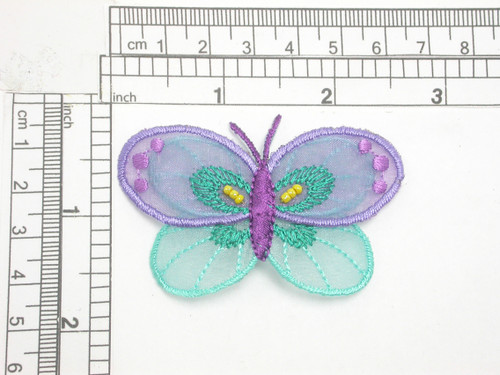 Butterfly Patch Sheer Beaded Iron On Embroidered Applique
Embroidered on Purple & Turquoise sheer backing
measures 2 1/2" across x 1 5/8" high