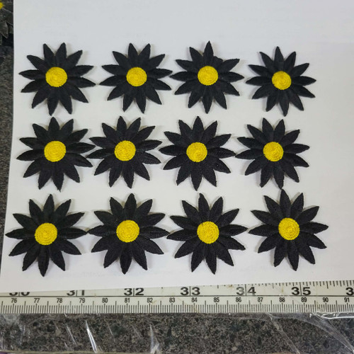 12 x Daisy Black & Yellow 12 Petal Iron On Patch Applique  Measures 1 1/2" 
 Measures 1 1/2" high x  1 1/2" wide