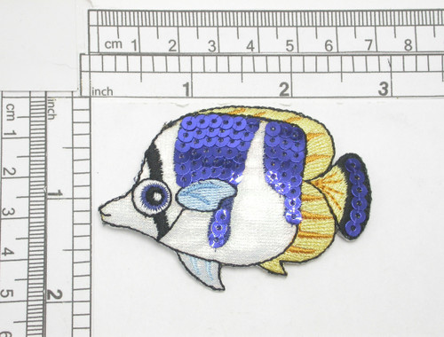 Emperor Angel Large Sequin Holographic Fish Iron On Patch Applique  

 Embroidered on a White Holographic Backing and detailed with Navy Blue Sequins

Measures 2 5/8 " across x 1 7/8" high