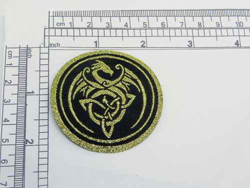 Celtic Dragon Iron on Woven Patch Applique Black & Metallic Gold

Measures 55mm x 55mm  (2 1/4" x 2 1/4")