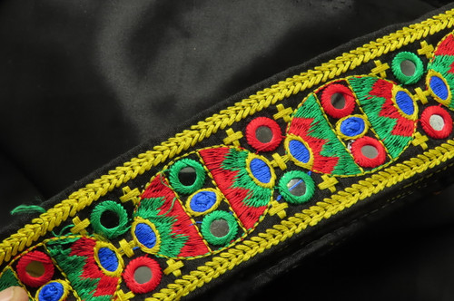 Mirrored Boho Style Embroidered Trim 2 1/8" 54mm Priced Per Yard

Bright Vibrant Thick Embroidery on a black backing - edges are folded and stitched to prevent fraying

Mirrors are a plastic not glass

 