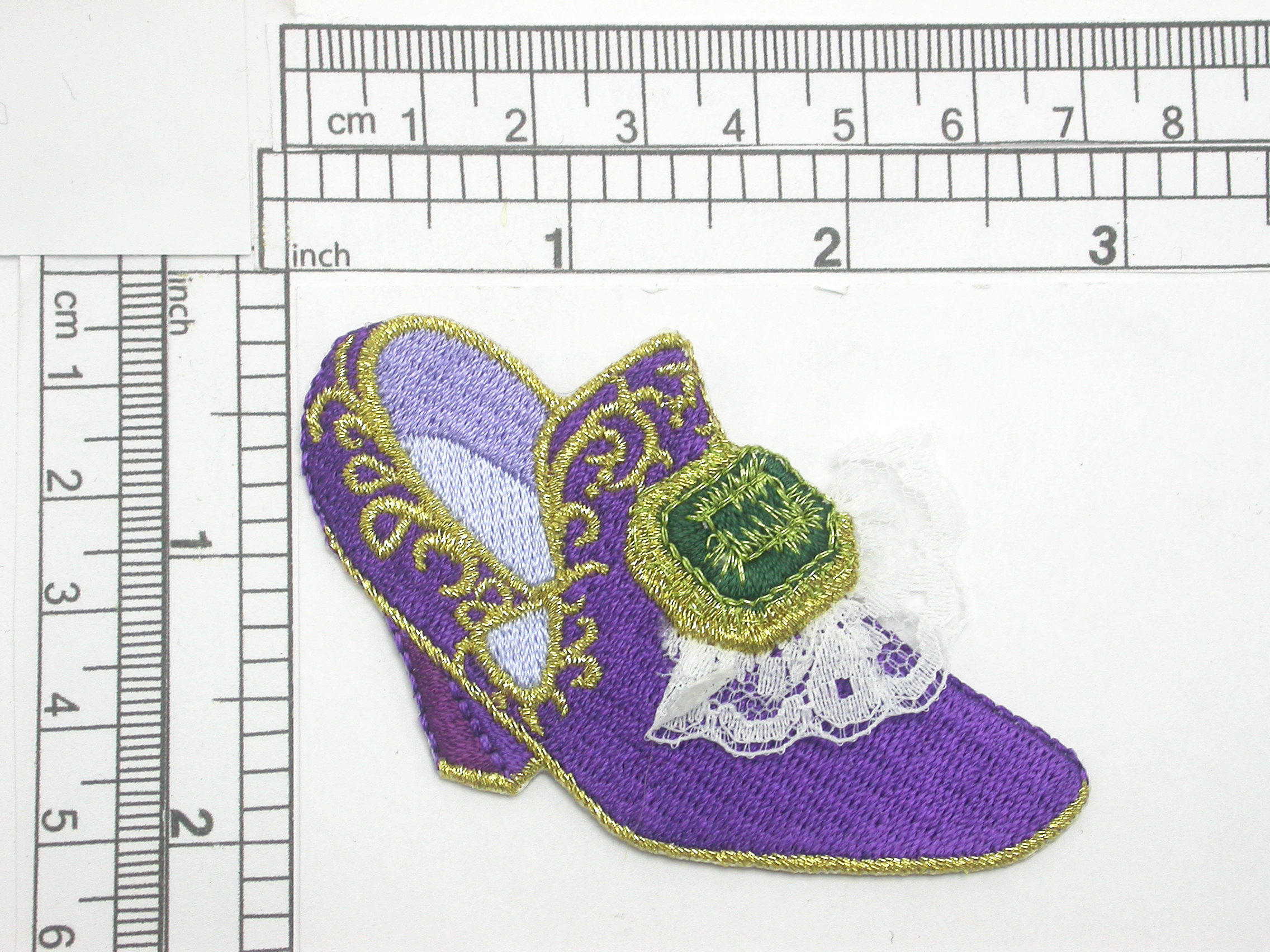 Footwear Slipper Purple Iron On Patch Applique

Fully Embroidered with Lace Detailing

Measures 1 3/4" x 3" Wide Approximately