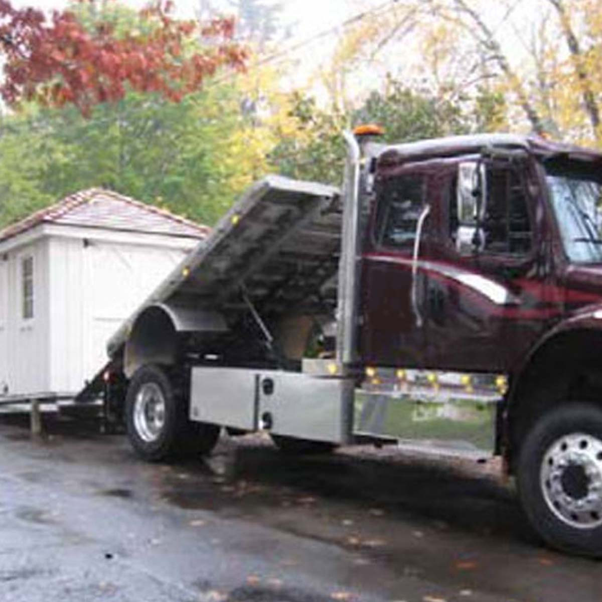 Assembled shed delivered on truck.
