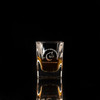 Wholesale engraved 2 oz. Prism Shot Glass customized with Copper Fox Distillers logo on a black background