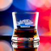 Wholesale engraved 8.5 oz. Samba Bourbon Glass customized with West River Whiskey logo on a bokeh background
