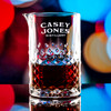Wholesale engraved Carats Mixing Glass customized with Casey Jones Distillers logo on a bokeh background