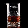 Wholesale engraved Carats Mixing Glass customized with Casey Jones Distillers logo on a black background